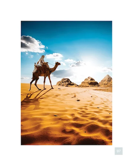 Image of a man riding a camel in a desert
